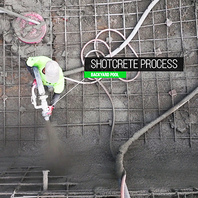 Image of worker shooting concrete in a pool